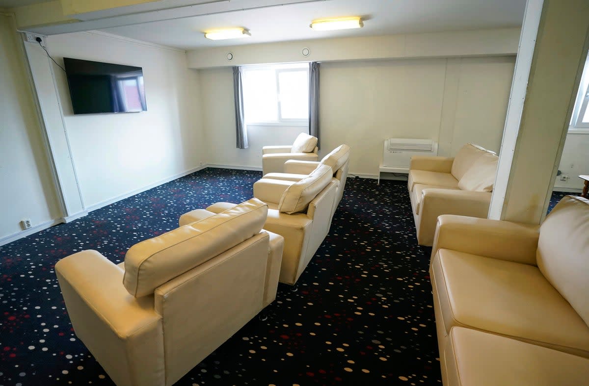 A room for residents to watch television onboard the Bibby Stockholm accommodation barge (AP)