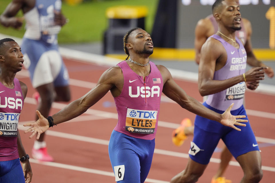 Noah Lyles, of the United States celebrates after winning the gold medal in the Men's 200-meters final during the World Athletics Championships in Budapest, Hungary, Friday, Aug. 25, 2023. (AP Photo/Martin Meissner)