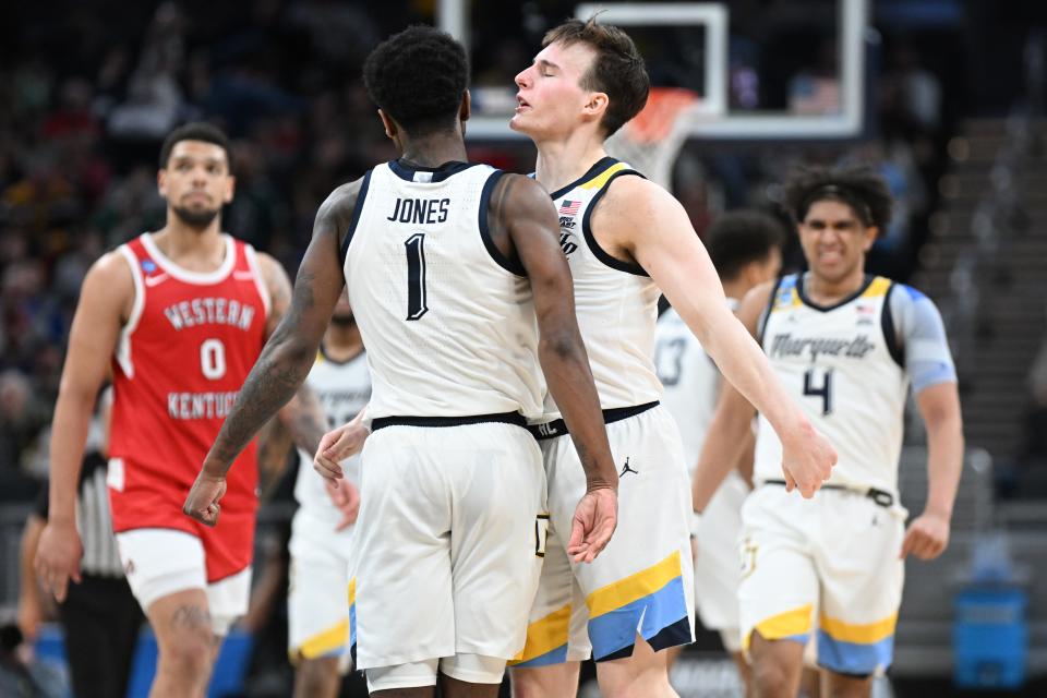 Marquette guard Tyler Kolek and guard Kam Jones celebrate in the second half against Western Kentucky in the first round of the 2024 NCAA Tournament at Gainbridge FieldHouse.