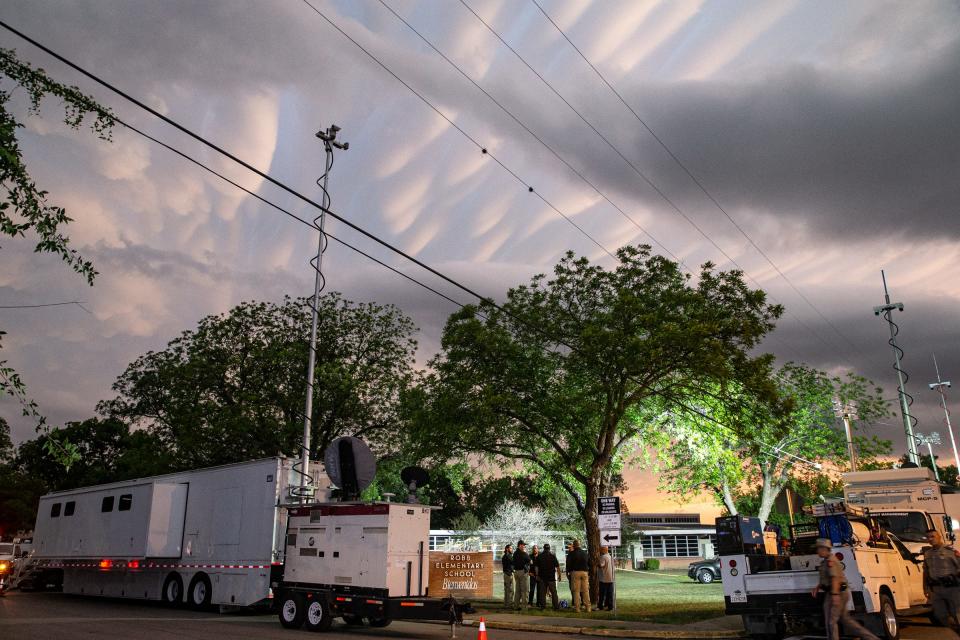 Emergency responders block off Robb Elementary School where at least 18 people including children were killed in a shooting Tuesday morning on May 24, 2022, in Uvalde, Texas.