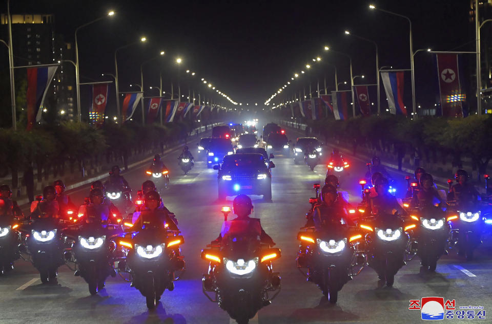 In this photo provided by the North Korean government, a motorcade with Russian President Vladimir Putin and North Korea's leader Kim Jong Un head to the state guest house in Pyongyang, North Korea, early Wednesday, June 19, 2024. The content of this image is as provided and cannot be independently verified. Korean language watermark on image as provided by source reads: "KCNA" which is the abbreviation for Korean Central News Agency. (Korean Central News Agency/Korea News Service via AP)