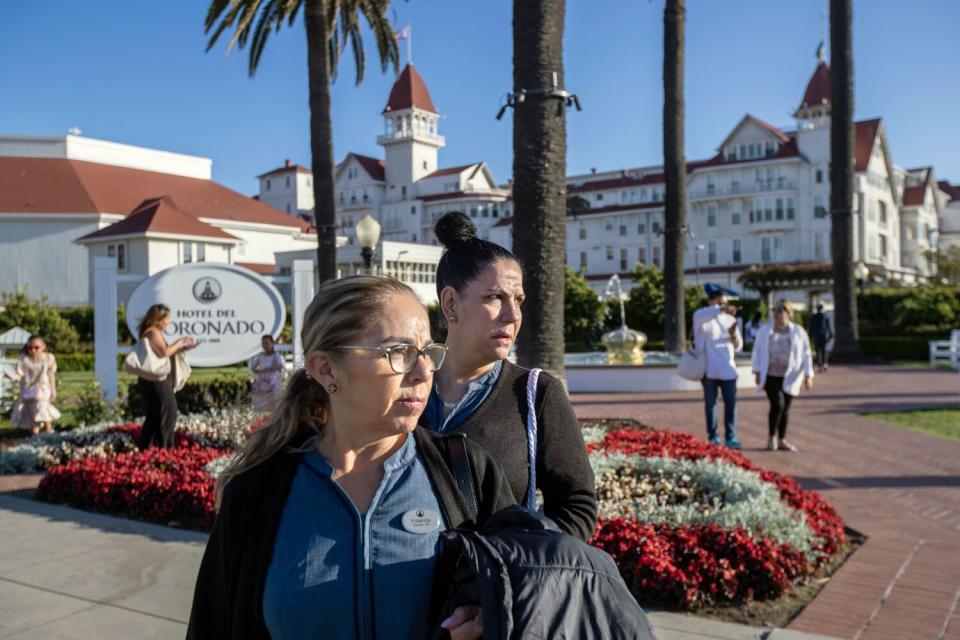 Two women stand in front of Hotel del Coronado in Coronado