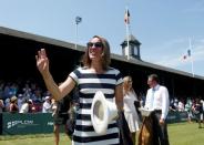 Justine Henin of Belgium waves to the crowd after being inducted into the International Tennis Hall of Fame in Newport, Rhode Island, U.S. July 16, 2016. REUTERS/Mary Schwalm