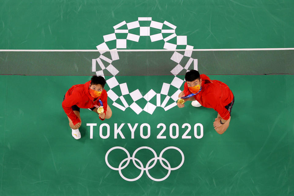<p>CHOFU, JAPAN - JULY 31: Gold medalists of Mix Doubles badminton event Wang Yi Lyu(right) and Huang Dong Ping of Team China pose for photo on day eight of the Tokyo 2020 Olympic Games at Musashino Forest Sport Plaza on July 31, 2021 in Chofu, Tokyo, Japan. (Photo by Rob Carr/Getty Images)</p> 