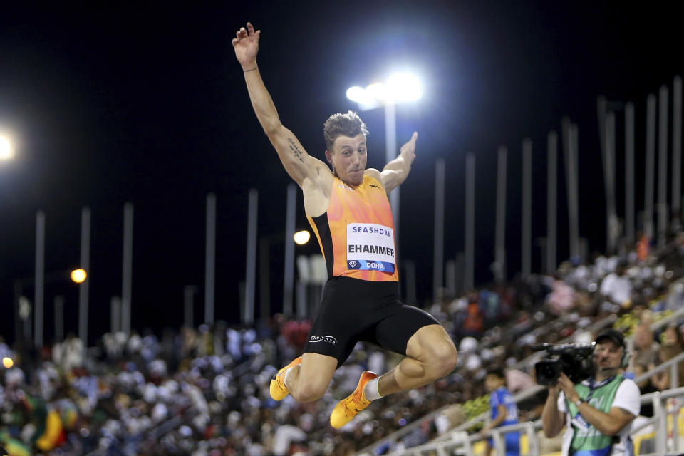 Simon Ehammer, of Switzerland, makes an attempt in the men's long jump during the Diamond League athletics meet at the Qatar Sports Club stadium in Doha, Friday, May 10, 2024. (AP Photo/Hussein Sayed)