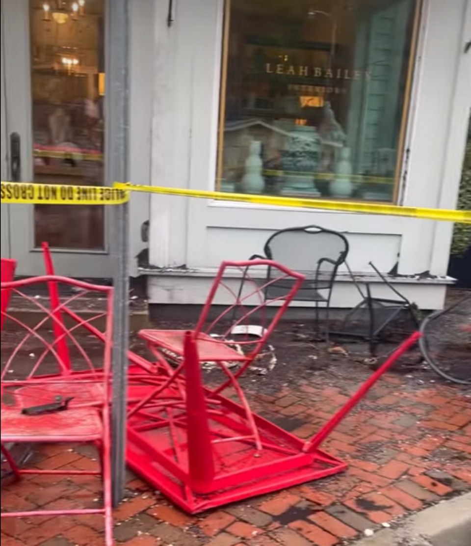 Debris and turned over tables and chairs outside of Corner perk in Old Town Bluffton after drunk driver crashed into porch Saturday night.