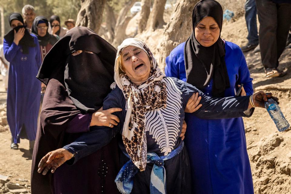 A woman is helped as she reacts to the death of relatives in an earthquake in the mountain village of Tafeghaghte, southwest of Marrakech, on Sept. 10, 2023. / Credit: Fadel Senna/AFP via Getty Images