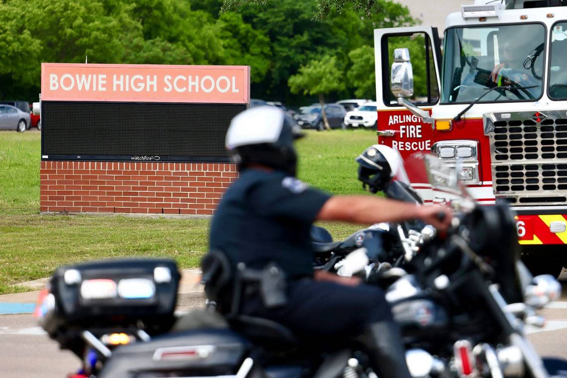 Emergency personnel investigate a shooting outside of Bowie High School in Arlington on Wednesday, April 24, 2024. One person was taken to a hospital in unknown condition, police said.