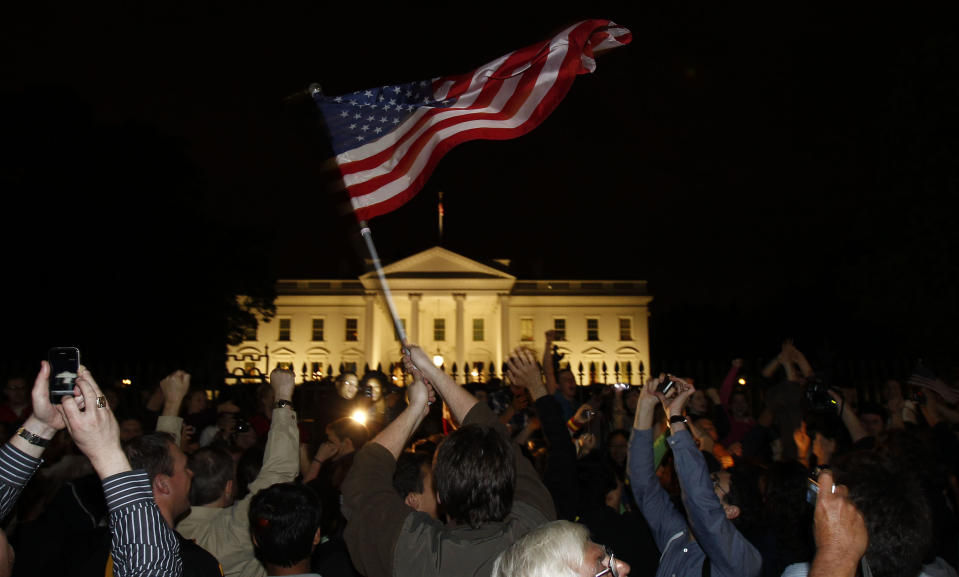 People cheer outside the White House as President Obama delivers remarks to the nation on the death of Osama bin Laden, May 1, 2011. REUTERS/Jim Young