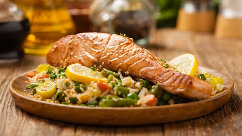 salmon over rice and vegetables