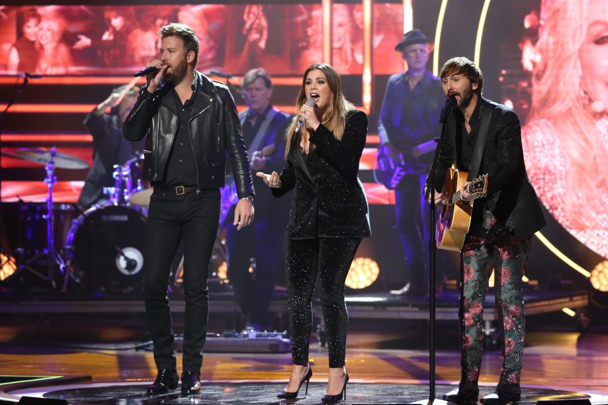 Charles Kelley, Hillary Scott and Dave Haywood of Lady Antebellum perform onstage during the 2019 CMT Artists of the Year, Nashville, other musicicans in the background
