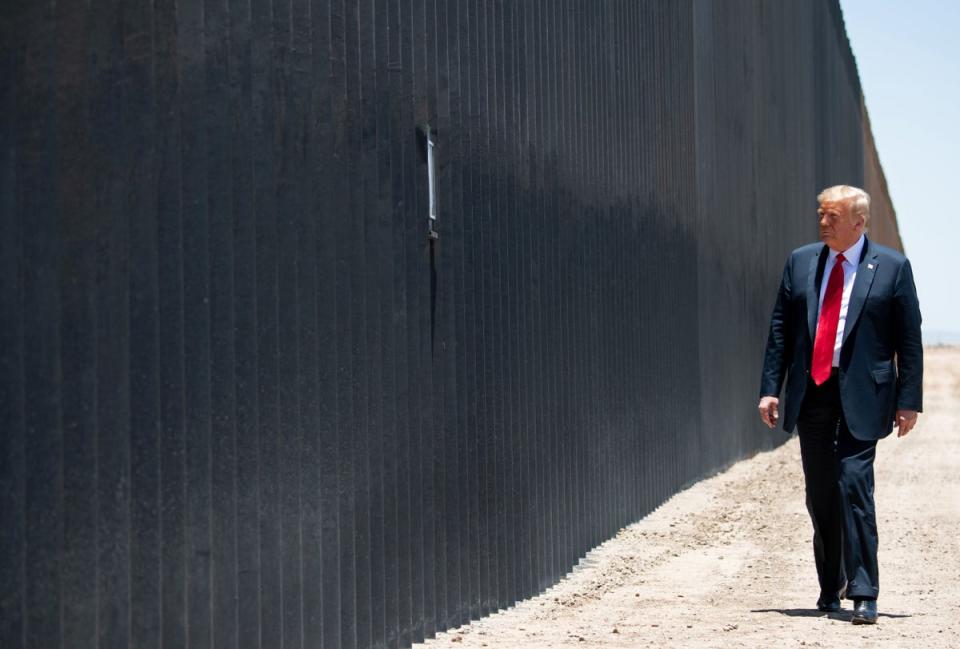 Donald Trump participates in a ceremony commemorating the 200th mile of border wall at the international border with Mexico in San Luis, Arizona, 23 June 2020 (AFP via Getty Images)