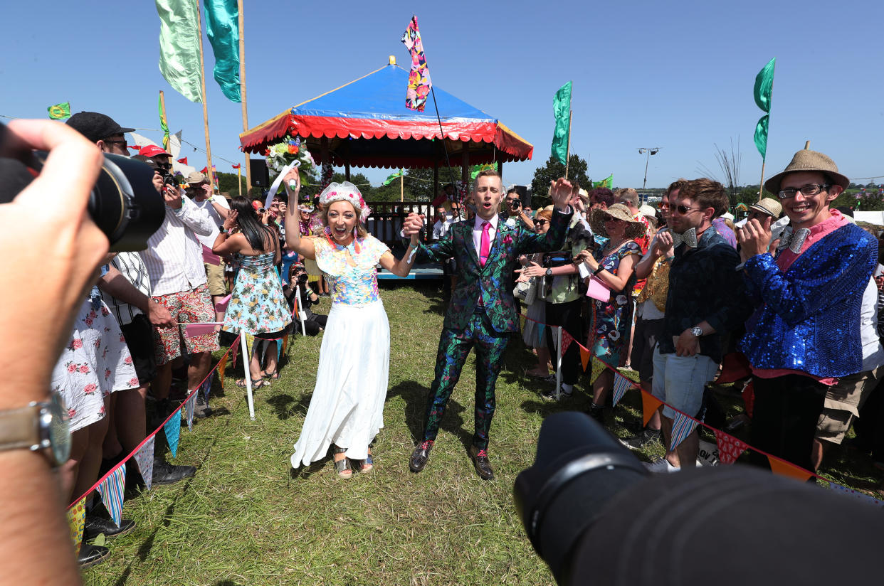 A wedding celebration for Jack Watney, 32, and Sarah Adey, 31, at The Croissant Neuf bandstand at Glastonbury (PA)