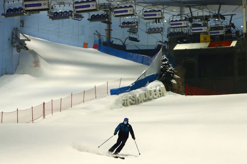 A man wears a protective face mask as he skis at Ski Dubai during the reopening of malls, following the outbreak of the coronavirus disease (COVID-19), at Mall of the Emirates in Dubai