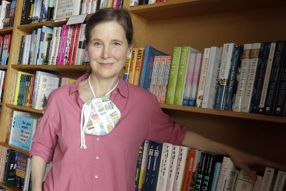 FILE - Novelist Ann Patchett poses in her independent bookstore, Parnassus Books, in Nashville, Tenn., on June 25, 2020. President Joe Biden will award Patchett with the 2021 National Humanities Medal on March 21, 2023. (AP Photo/Mark Humphrey, File)