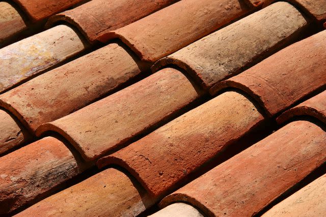 <p>AdStock / Getty Images</p> Barrel tile roof