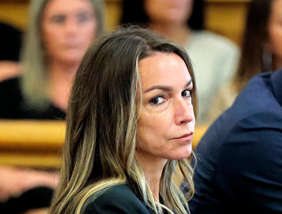 Karen Read looks toward the jurors, as they are greeted by Judge Beverly J. Cannone at Norfolk Superior Court in Dedham, Mass., Monday, July 1, 2024. This is their fifth day of deliberations in the murder trial for Read. Read is accused of backing her SUV into her Boston Police officer boyfriend, John O'Keefe, and leaving him to die in a blizzard in Canton, in 2022. (Pat Greenhouse/The Boston Globe via AP, Pool)