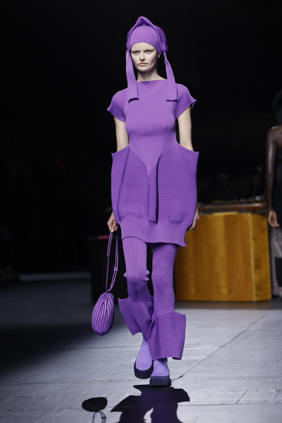 A model wears a creation as part of the Issey Miyake Fall/Winter 2023-2024 ready-to-wear collection presented Friday, March 3, 2023 in Paris. (Vianney Le Caer/Invision/AP)