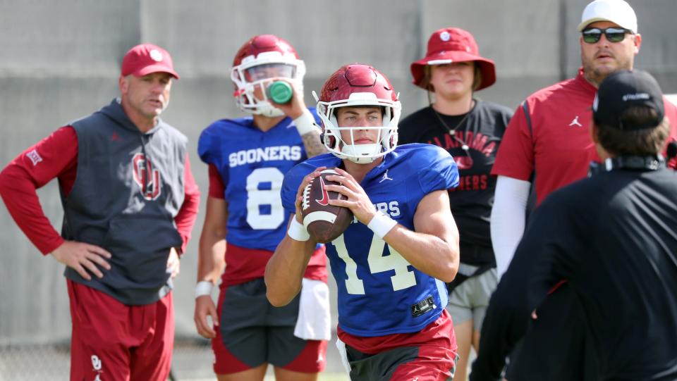 OU quarterback General Booty (14) goes through drills during practice on Aug. 8 outside Gaylord Family-Oklahoma Memorial Stadium in Norman.