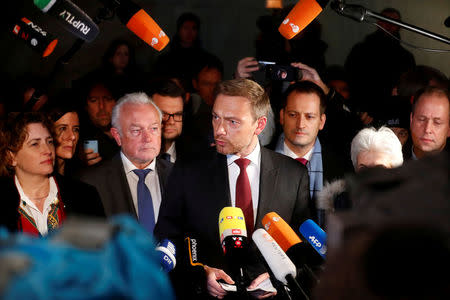 Chairman of the Free Democratic Party (FDP) Christian Lindner, and party members Wolfgang Kubicki and Nicola Beer speak to the press during the exploratory talks about forming a new coalition government in Berlin, Germany, November 19, 2017. REUTERS/Hannibal Hanschke