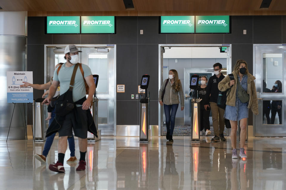 Passengers arrive at the new West Gates at Tom Bradley International Terminal at Los Angeles International Airport Monday, May 24, 2021, in Los Angeles. (AP Photo/Ashley Landis)