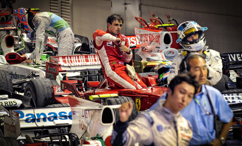 Brazilian driver Felipe Massa of Ferrari steps out of his car at the end of Formula One's Singapore Grand Prix on Sept. 28, 2008. (Saeed Kahn / AFP via Getty Images file)