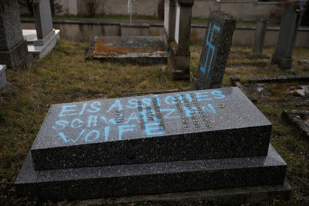 Graves desecrated with swastikas are seen in the Jewish cemetery in Quatzenheim, near Strasbourg, France, February 19, 2019. REUTERS/Vincent Kessler