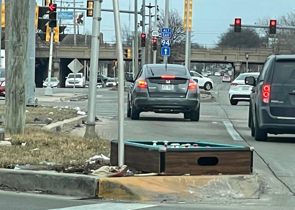 A bumper pool table was left abandoned near the intersection of Capitol and Roosevelt drives in Milwaukee on March 4. The medians on Capitol Drive are usually littered with paper, glass bottles, beer cans, and fast-food wrappers until the City of Milwaukee's Department of Public Works or citizens living in the area pick up the trash.