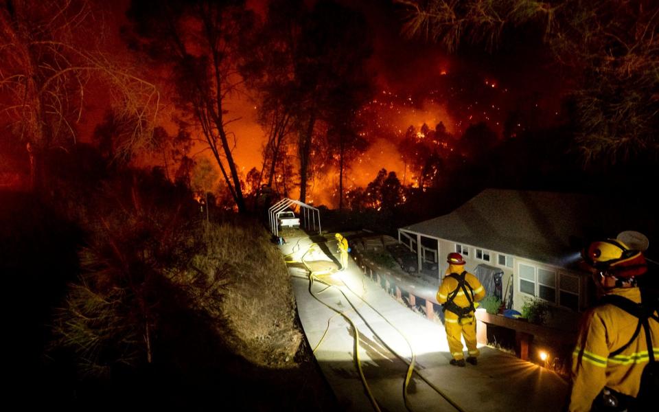 Fire crews protecting a home in Berryessa, Northern California - AP
