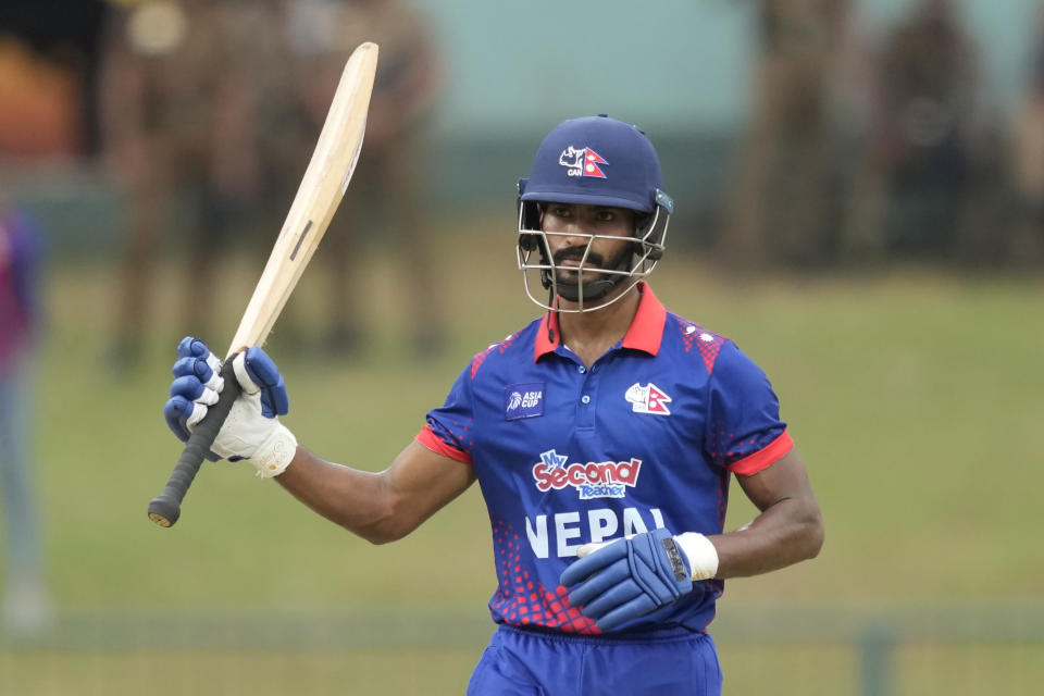 Nepal's Aasif Sheikh celebrates scoring a half century during the Asia Cup cricket match between India and Nepal in Pallekele, Sri Lanka on Monday, Sep. 4. (AP Photo/Eranga Jayawardena)