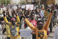 Anti-military protesters march on Friday, July 1, 2022 in Khartoum, Sudan, a day after nine people were killed in demonstrations against the country’s ruling generals. (AP Photo/Marwan Ali)