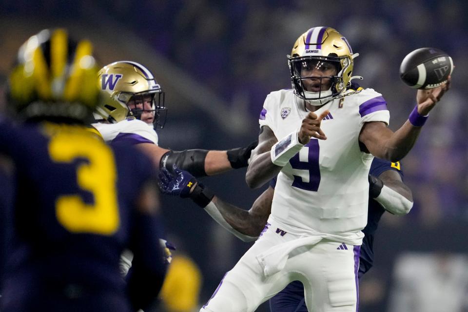 Washington quarterback Michael Penix Jr. passes against Michigan during the first half of the national championship NCAA College Football Playoff game Monday, Jan. 8, 2024, in Houston.