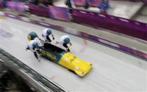Australia's pilot Heath Spence (R) and his teammates start during a four-man bobsleigh training event at the Sanki Sliding Center in Rosa Khutor, during the Sochi 2014 Winter Olympics February 20, 2014. REUTERS/Murad Sezer