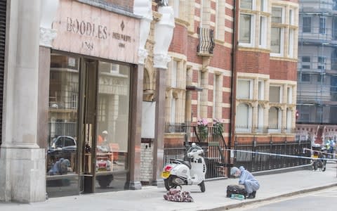 Forensic investigators outside Boodles after the raid - Credit: Amer Ghazzal/Alamy Live News