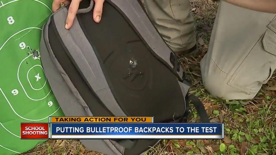 Bullet holes from an AR-15 rifle appear in the back of&nbsp;Guard Dog Security's bulletproof backpack.&nbsp; (Photo: WFTS)