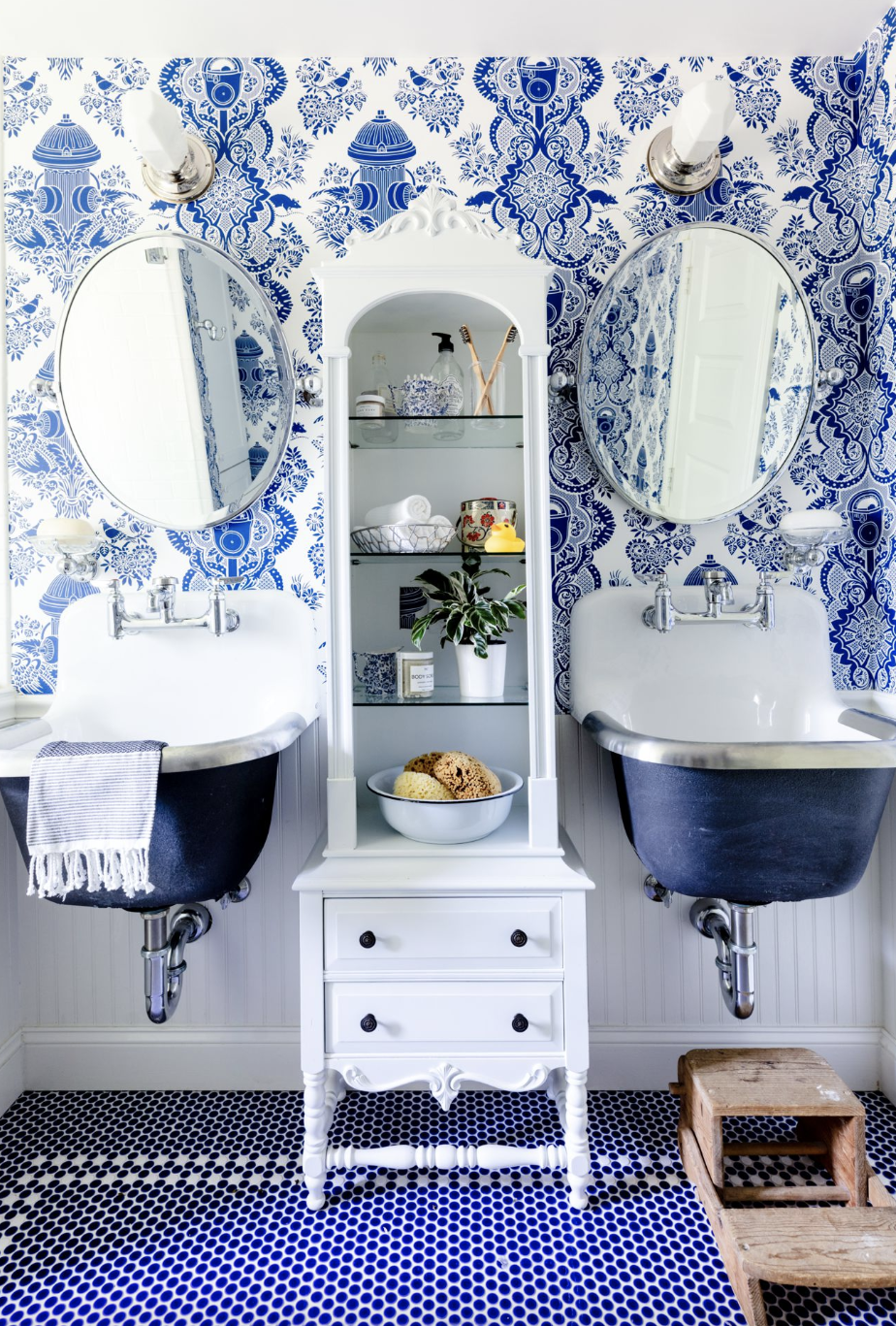 bathroom shelf ideas, an open shelf vintage cabinet in the bathroom between two sinks