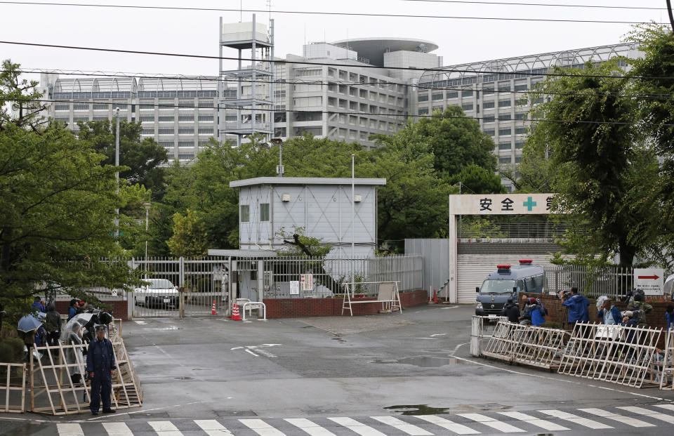 FILE - In this July 6, 2018, file photo, police officers stand guard outside Tokyo Detention Center where Aum Shinrikyo cult leader Shoko Asahara was executed, in Tokyo. Three of the last six members of the Japanese doomsday cult who remained on death row were executed in the center Thursday, July 26, 2018, for a series of crimes in the 1990s including a sarin gas attack on Tokyo subways that killed 13 people. (AP Photo/Shuji Kajiyama, File)