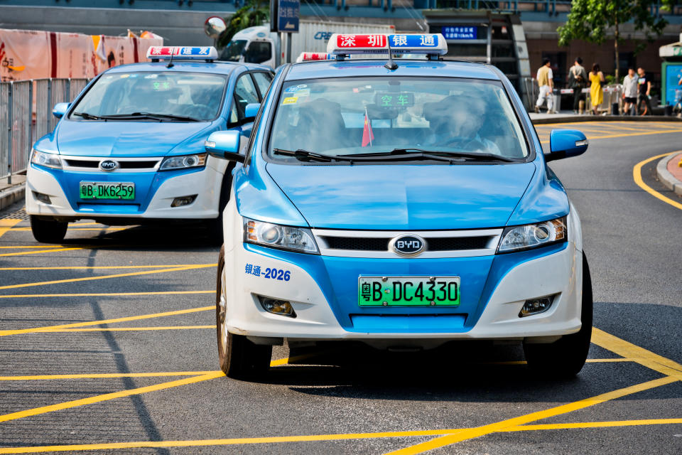 Shenzhen, China - October 22, 2019: BYD Electric taxis waiting near train station. Shenzhen, the ultra modern city with 15 million people is located in southern China.