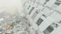 Rescue workers search for survivors at a 17-storey building which collapsed during an earthquake in Tainan, southern Taiwan, in this still image taken from video shot on February 6, 2016. REUTERS/CTI via Reuters TV