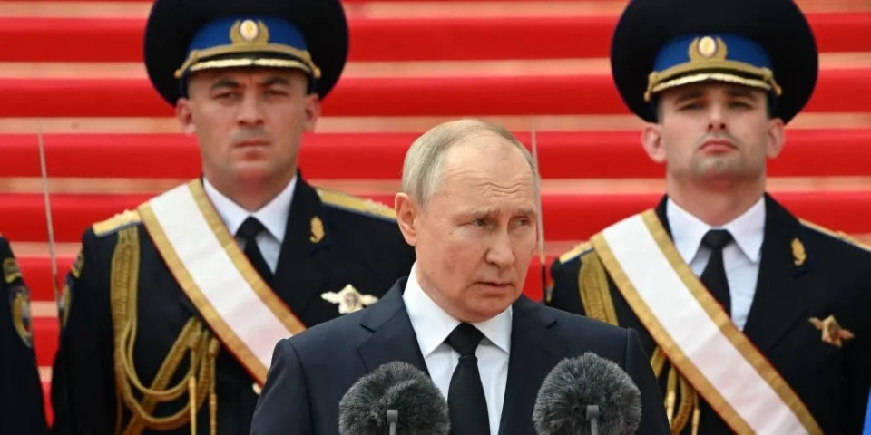 Russian President Vladimir Putin addresses troops from the defence ministry, National Guard, FSB security service and interior ministry gathered on the Sobornaya (Cathedral) Square from the porch of the the Palace of the Facets on the grounds of the Kremlin in central Moscow on June 27, 2023.