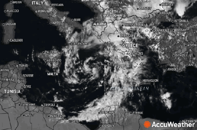 A visible satellite image shows the storm rotating over the Mediterranean Sea Tuesday evening local time.