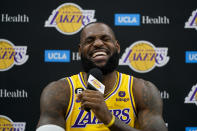 Los Angeles Lakers' LeBron James laughs while listening to a question during a news conference at the NBA basketball team's Media Day Monday, Sept. 26, 2022, in El Segundo, Calif. (AP Photo/Jae C. Hong)