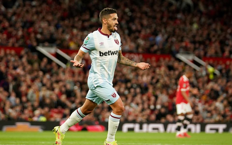 West Ham's Manuel Lanzini celebrates scoring the opening goal during the English League Cup soccer match between Manchester United and West Ham at Old Trafford in Manchester, England, Wednesday, Sept. 22, 2021. - AP