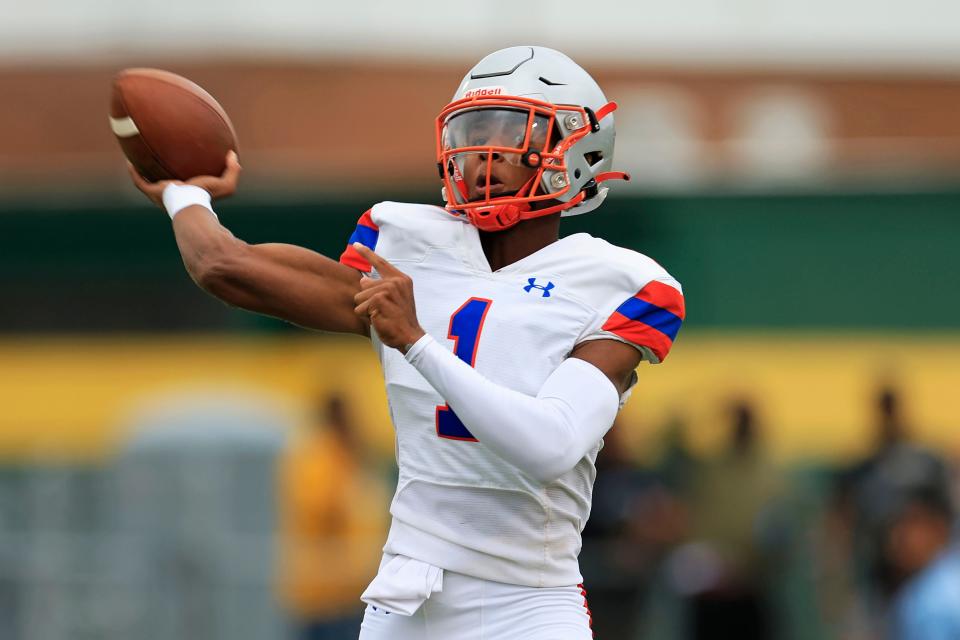 Bolles' DJ Moore (1) looks to pass during the first quarter of the Bulldogs' spring game against Ed White.