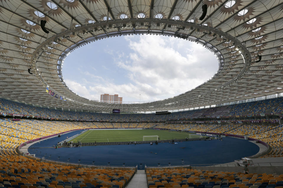 FILE - A general view at the Olympic national stadium in Kyiv, Ukraine, June 10, 2012. In Ukraine and Turkey, the national soccer league titles can be decided in showdown games this month between the top two teams in the standings. That the leagues are set to be completed at all is remarkable. (AP Photo/Andrey Lukatsky, File)