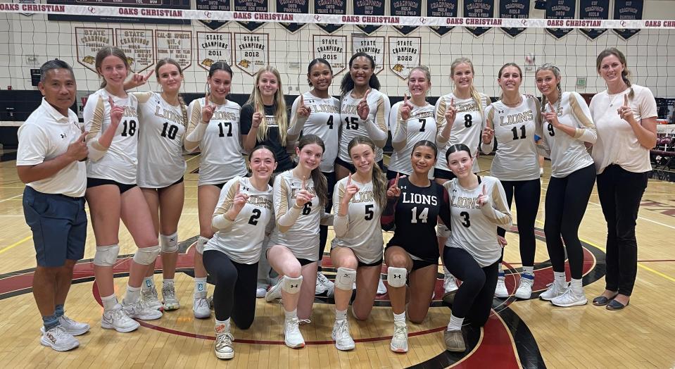 The Oaks Christian School girls volleyball team poses for a photo after beating Agoura in straight sets on Thursday night at home to clinch the Marmonte League title outright. The Lions, who are 19-7 overall, are 9-0 in Marmonte play with one league game remaining.