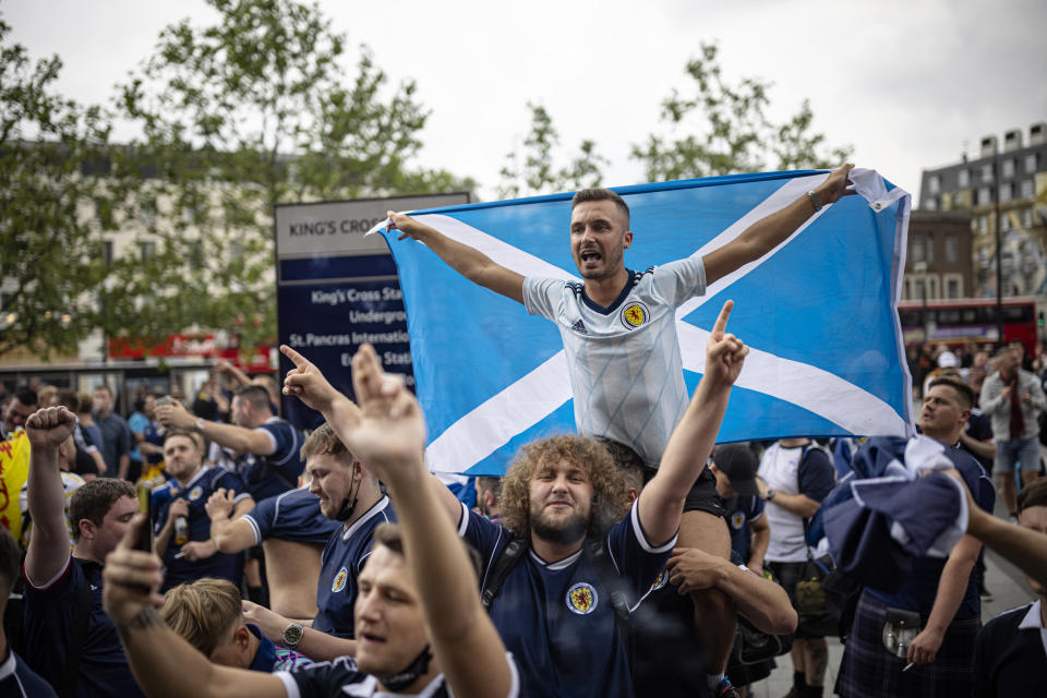 LONDON, ENGLAND - JUNE 17: Scotland fan chanting outside King's Cross Station on June 17, 2021 in London, England. Officials in Scotland and London, where the match will be hosted at Wembley Stadium, have discouraged Scottish fans without tickets to the game of coming south, due to concerns about the spread of Covid-19. (Photo by Rob Pinney/Getty Images)