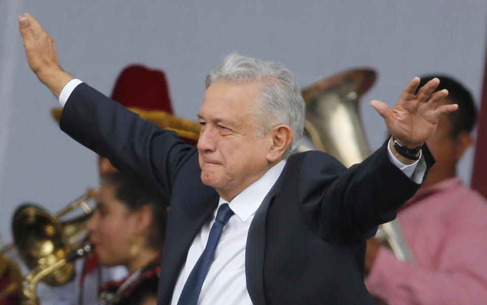 Mexico's President Andres Manuel Lopez Obrador arrives at a rally to celebrate the one-year anniversary of his election, in Mexico City's main square, the Zocalo, Monday, July 1, 2019.(AP Photo/Fernando Llano)