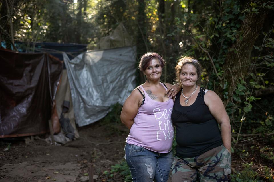 Flora Harlow and Kat Ryan-Butts stand for a portrait near their tents Sept. 9 in Athens, Ga. Harlow and Ryan-Butts are often referred to as the "queens" of Cooterville because they are known throughout their small encampment as someone you go to when you're in need.