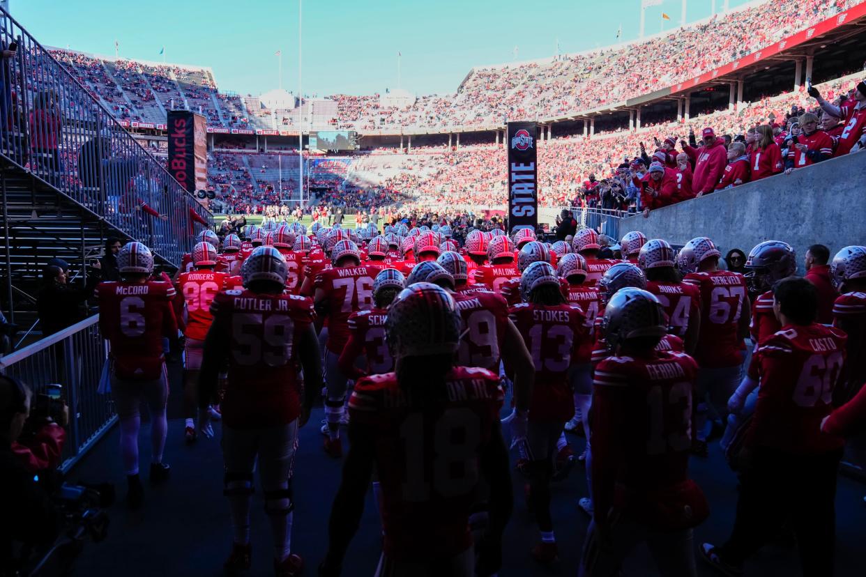 The Ohio State football team takes the field prior to a game against Minnesota on Nov. 18.